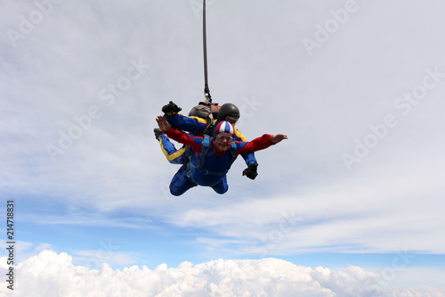 Tandem skydiving. Two men are in the sky.