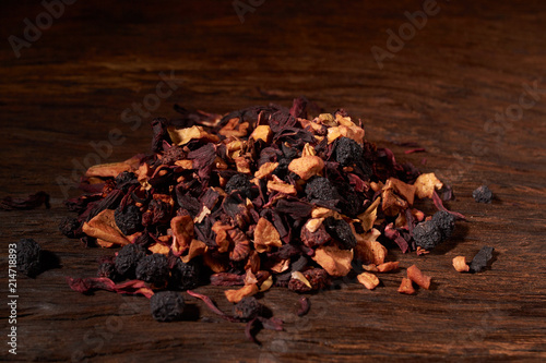 Still life, aromatic dry tea with fruits and petals, close up on white background, selective focus