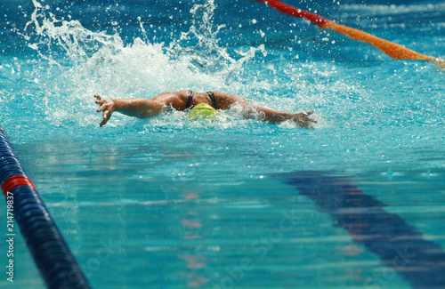 Woman Swim Butterfly Stroke in Swimming Pool