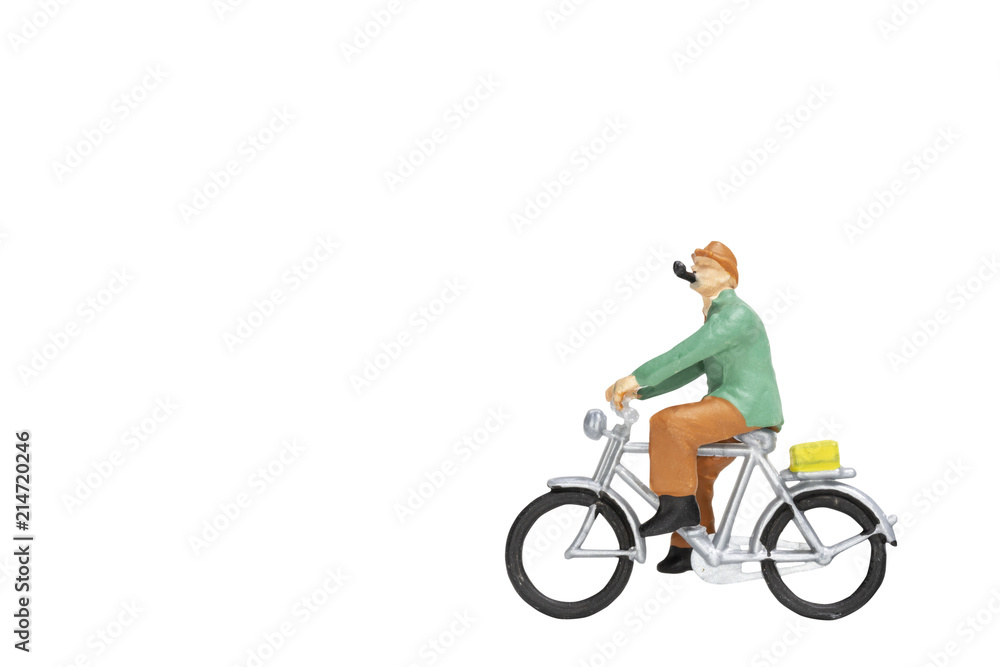 Miniature people travellers with bicycle isolate on white background with clipping path Miniature people travellers with bicycle isolate on white background with clipping path
