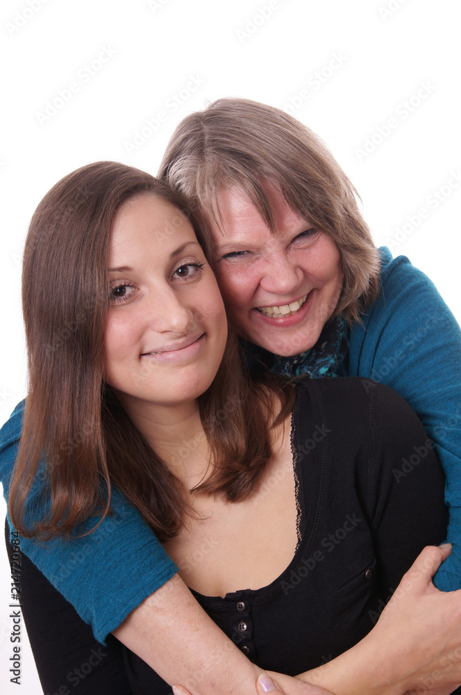 mother hugging her pretty daughter, isolated on white mother hugging her pretty daughter, isolated on white