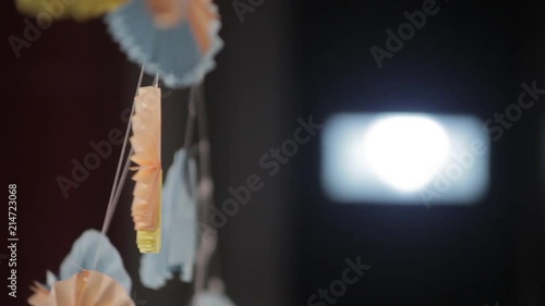 Hanged circle shaped paper decorations in the night photo