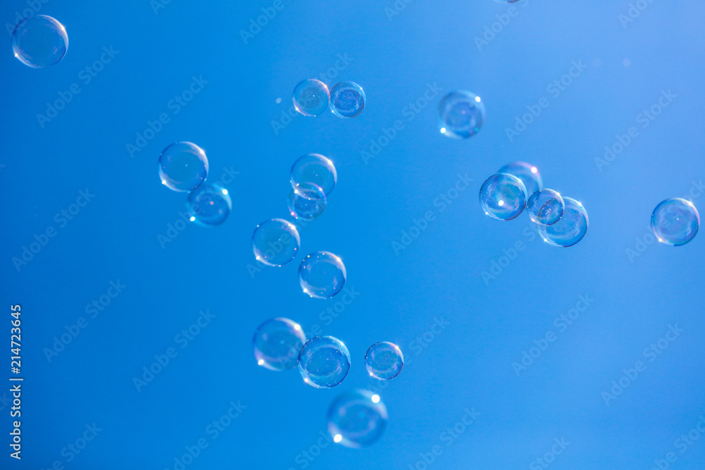 Soap bubbles in flight against the blue sky Soap bubbles in flight against the blue sky