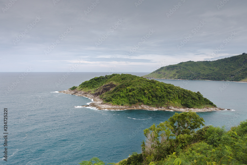 Phuket, Thailand. Promthep Cape early in the morning. View of the coast and the island in the Andaman sea