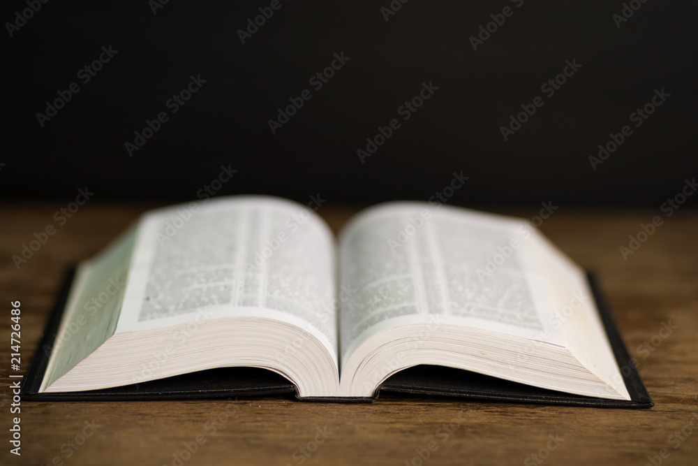 Book page in heart shape with dark background. Conceptual Heart from Book. Copy Space Book page in heart shape with dark background. Conceptual Heart from Book. Copy Space