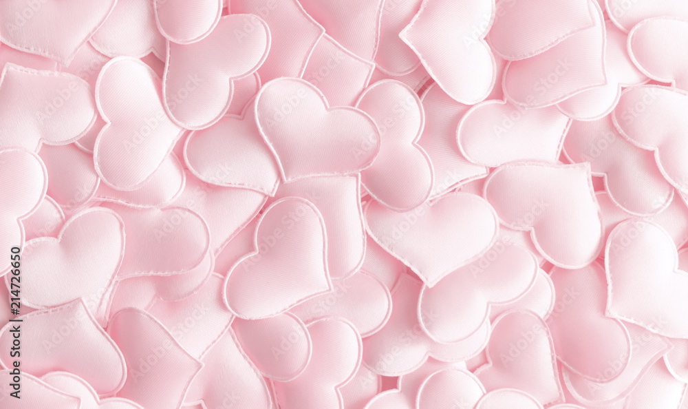 Obraz premium Valentines day background with hearts pink silk, copy space. Valentine day concept for design. Flat lay, top view, copy space 