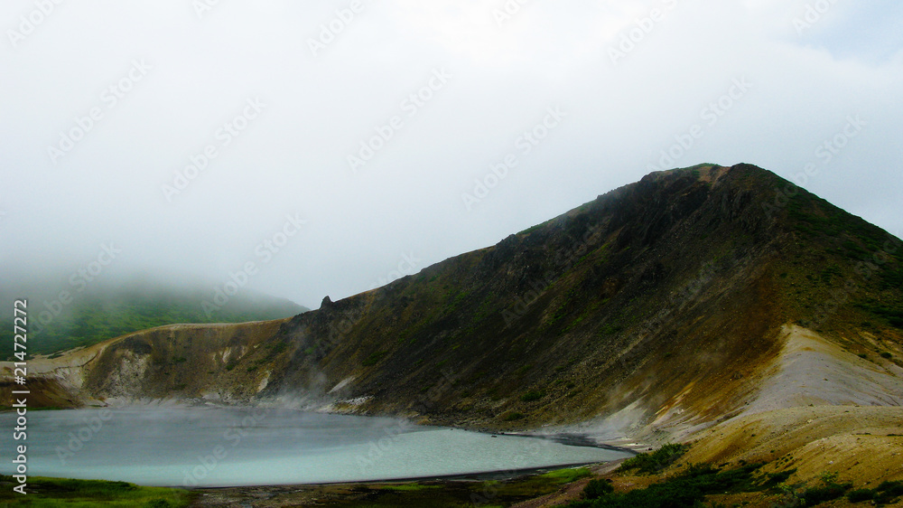 Steam lake in the crater of Golovnina volcano in Kunashir island Steam lake in the crater of Golovnina volcano in Kunashir island