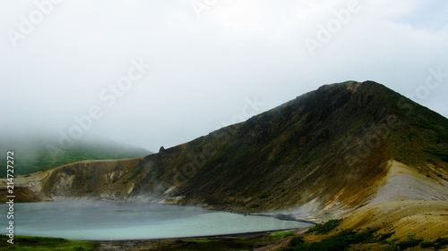Steam lake in the crater of Golovnina volcano in Kunashir island