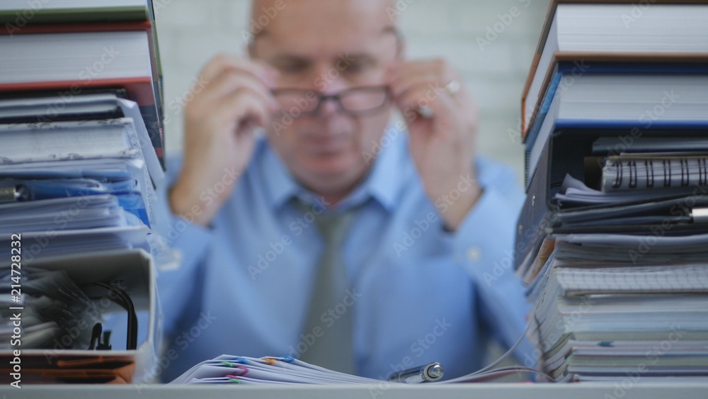 Obraz premium Businessman In Accounting Archive Working With Financial Documents