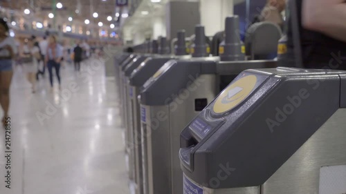 Wallpaper Mural Commuters swiping their travel cards on touch pad Torontodigital.ca