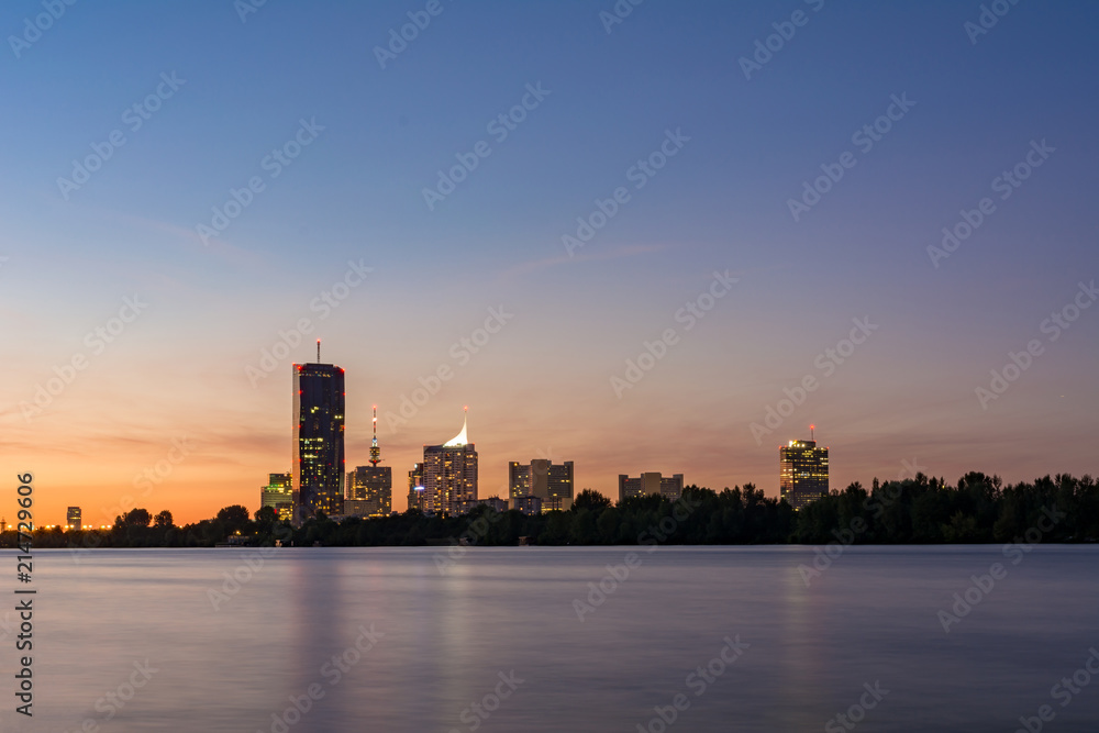 Vienna cityscape with Danube river at sunset