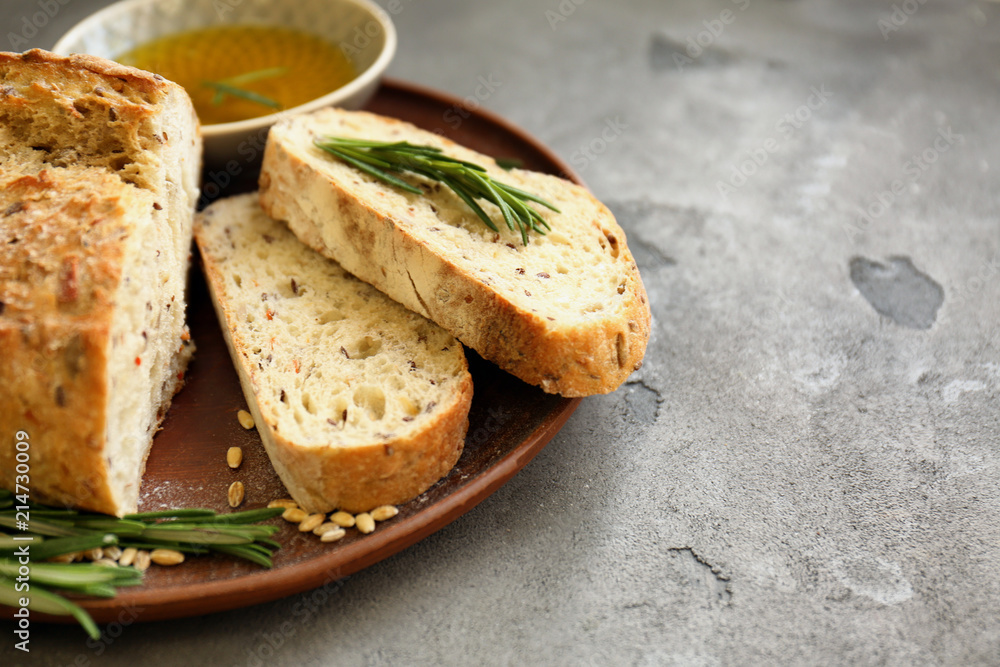 Plate with fresh tasty bread and oil on table Plate with fresh tasty bread and oil on table