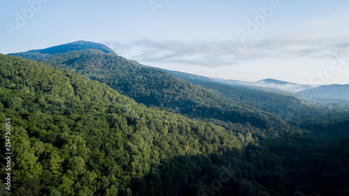 Epic Aerial Flight Through Mountain Clouds. Sunrise Beautiful Morning.