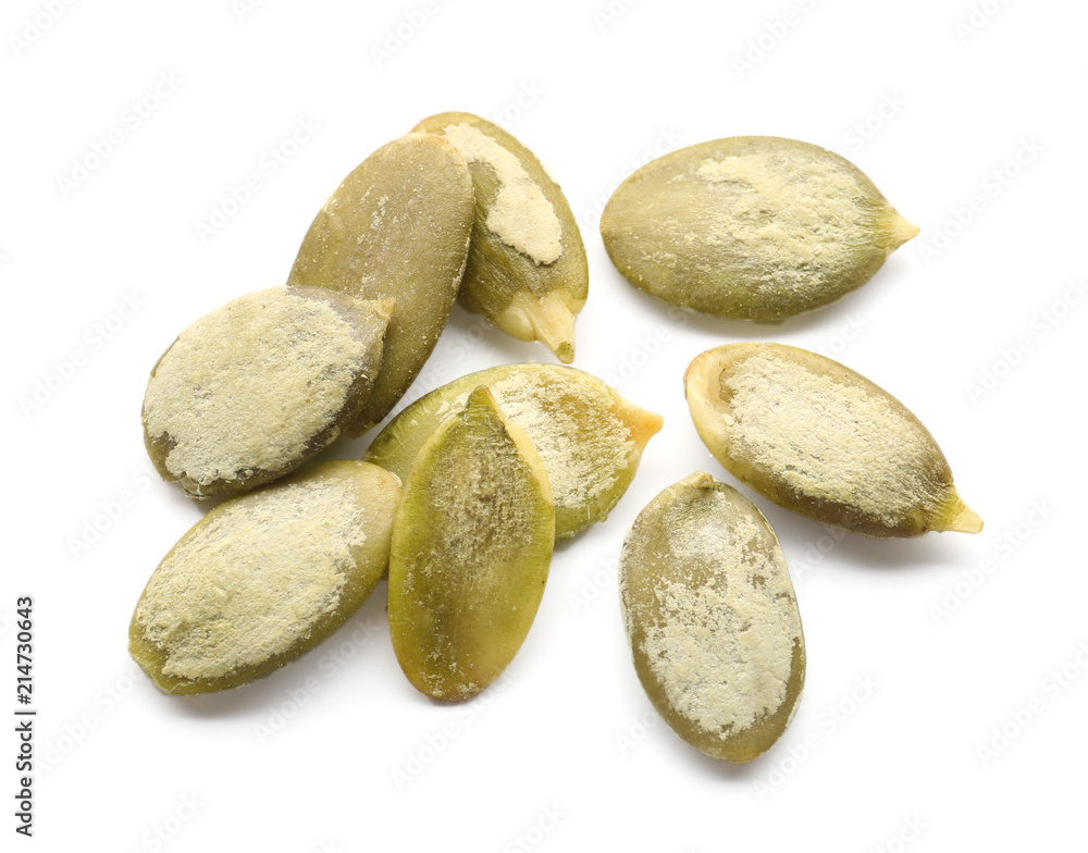 Obraz premium Pumpkin seeds for healthy nutrition and diet, organic superfood and plant based protein source, raw pepitas isolated on a clean white background