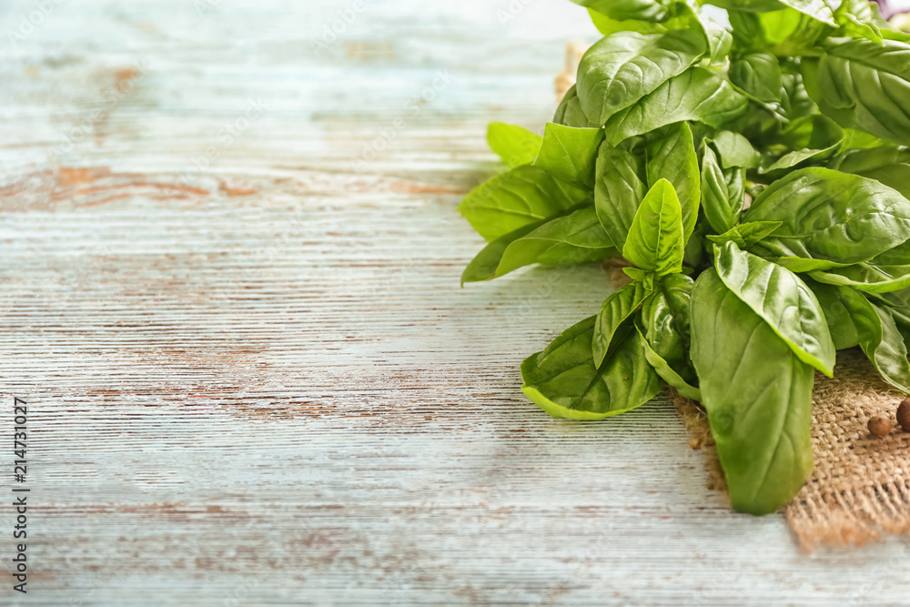 Fresh basil on wooden background Fresh basil on wooden background