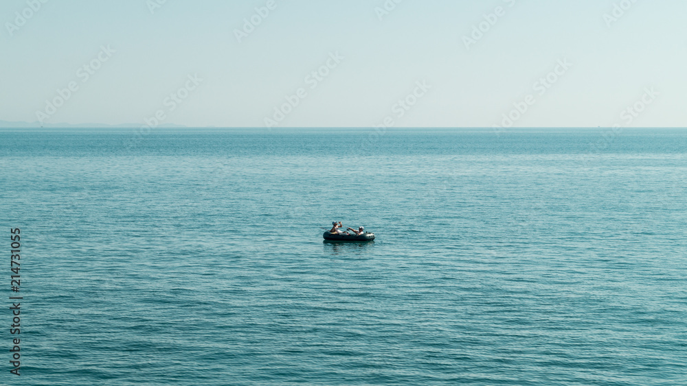 Small boat in the middle of the see fishing. Quite place peaceful. Adriatic see Albania
