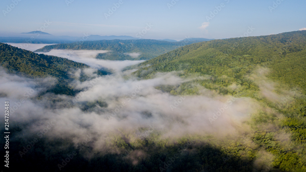 4K Epic Aerial Flight Through Mountain Clouds on Sunrise Beautiful Morning. Peaks Inspirational Motivational Nature Background. 4K Epic Aerial Flight Through Mountain Clouds on Sunrise Beautiful Morning. Peaks Inspirational Motivational Nature Background.