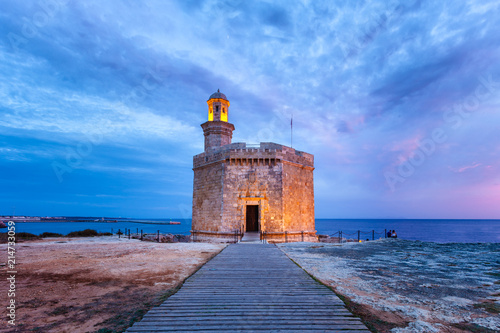 Castell de Sant Nicolau at Ciutadella, Menorca, on a beautiful sunset photo