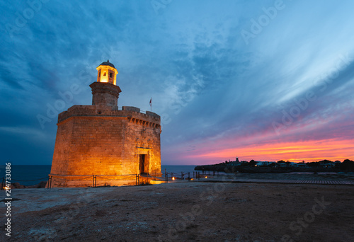 Castell de Sant Nicolau at Ciutadella, Menorca, on a beautiful sunset photo