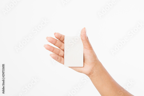 hand hold blank business card. female arm hold paper isolated on white background. copy space. mock up. photo