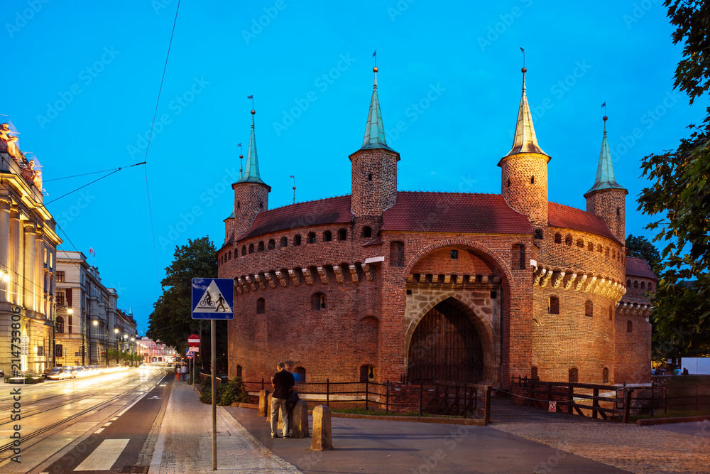 Fototapeta premium Barbican at night in the old town of Krakow, Poland.
