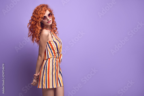Fashion Woman Smiling in Summer Outfit on Purple