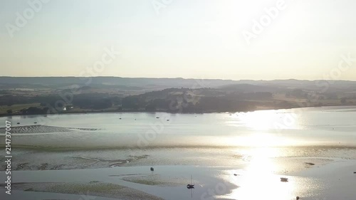 Lympstone harbour, right aerial pan. Sunset, sunrise. England. photo