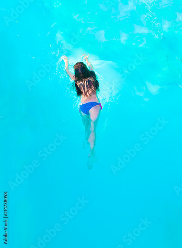 Girl swimming in pool