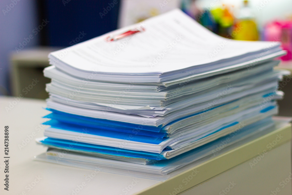 file folder and Stack of business report paper file on the table in a work office, concept document in work office file folder and Stack of business report paper file on the table in a work office, concept document in work office