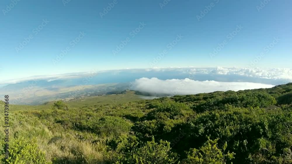 Beautiful valley with gorgeous clouds on the way down from the top of the Haleakala volcano in Maui, Hawaii. Beautiful valley with gorgeous clouds on the way down from the top of the Haleakala volcano in Maui, Hawaii.