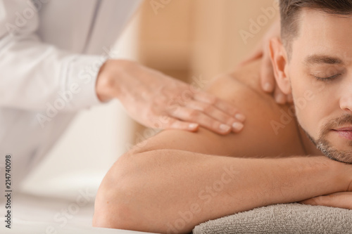 Man having massage in spa salon, closeup