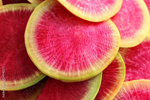 Ripe sliced radish as background, closeup
