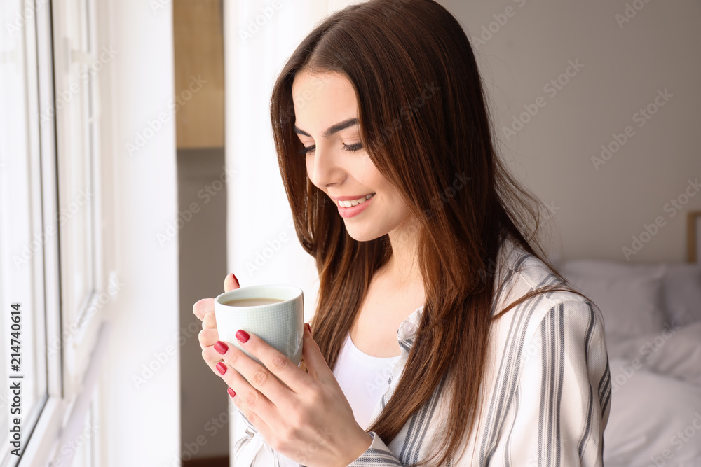 Morning of beautiful young woman drinking coffee at home Morning of beautiful young woman drinking coffee at home