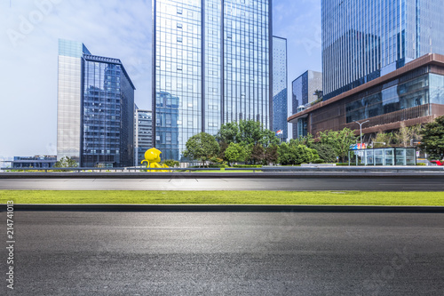 Panoramic skyline and modern business office buildings with empty road empty concrete square floor