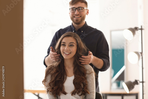 Professional hairdresser working with client in salon © Pixel-Shot