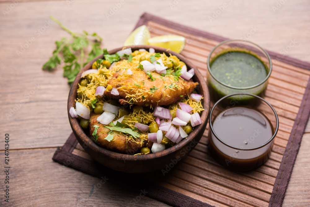 Ragda Pattice is a popular Street food or chat made of potato Patties. served in a steel plate, bowl or ceramic plate with tamarind and cilantro chutney Ragda Pattice is a popular Street food or chat made of potato Patties. served in a steel plate, bowl or ceramic plate with tamarind and cilantro chutney