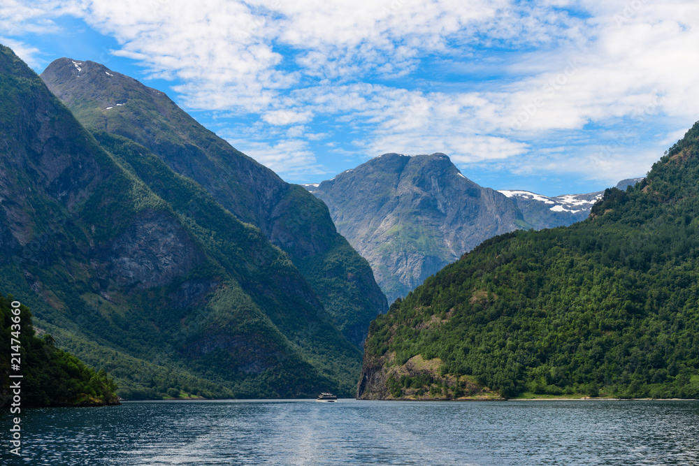 Magnificent fjord landscape with a trace from the boat. Neroyfjord offshoot of Sognefjord is the narrowest fjord in Europe. Norway.