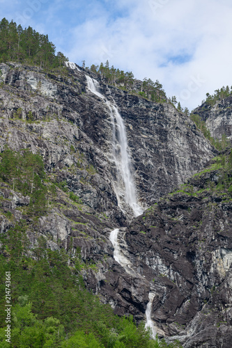 View of a waterfall from the fjord. Neroyfjord offshoot of Sognefjord is the narrowest fjord in Europe. Norway.