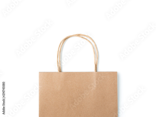 Top view brown paper shopping bag on white background, Mock-up of blank brown paper shopping bag and copy space. Flat lay.