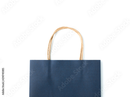 Top view blue paper shopping bag on white background, Mock-up of blank blue paper shopping bag and copy space. Flat lay.
