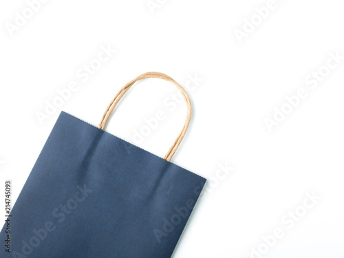 Top view blue paper shopping bag on white background, Mock-up of blank blue paper shopping bag and copy space. Flat lay.