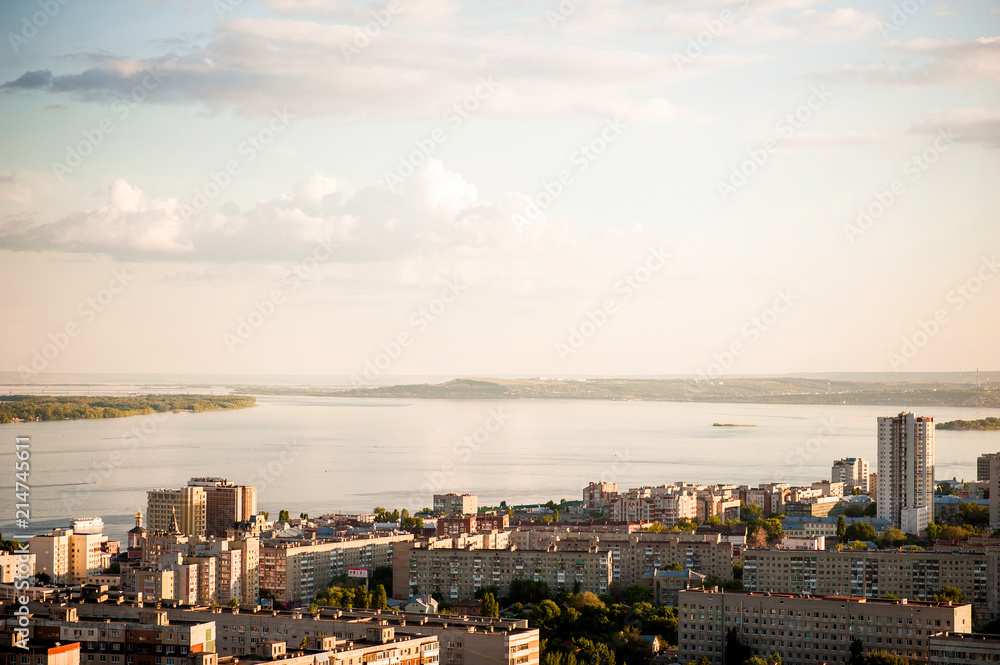 Saratov, Russia, view of the houses, the Volga River, the bridge to Engels. The landscape of the city from a height.