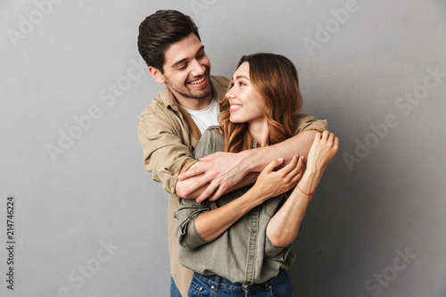 Portrait of a happy young couple hugging