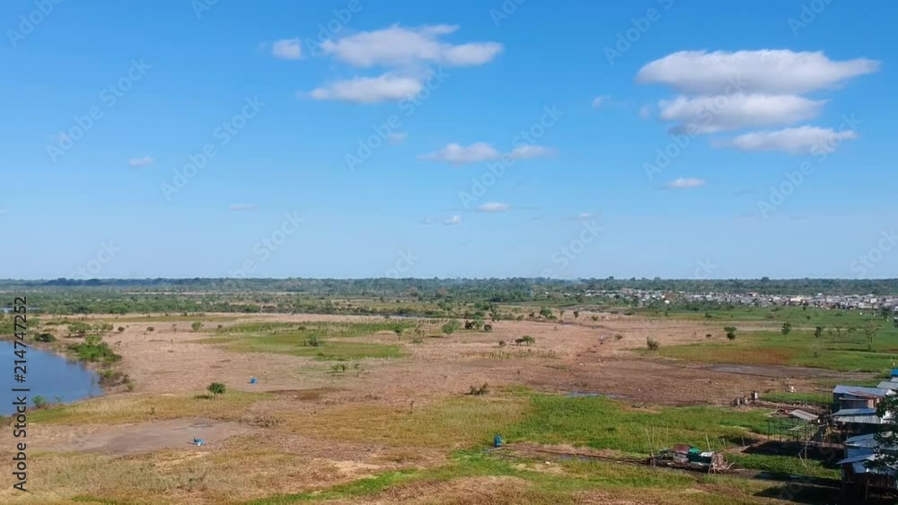 Pan of the landscape on the outskirts of Iquitos, Peru, along one of the tributaries of the Amazon River. Pan of the landscape on the outskirts of Iquitos, Peru, along one of the tributaries of the Amazon River.