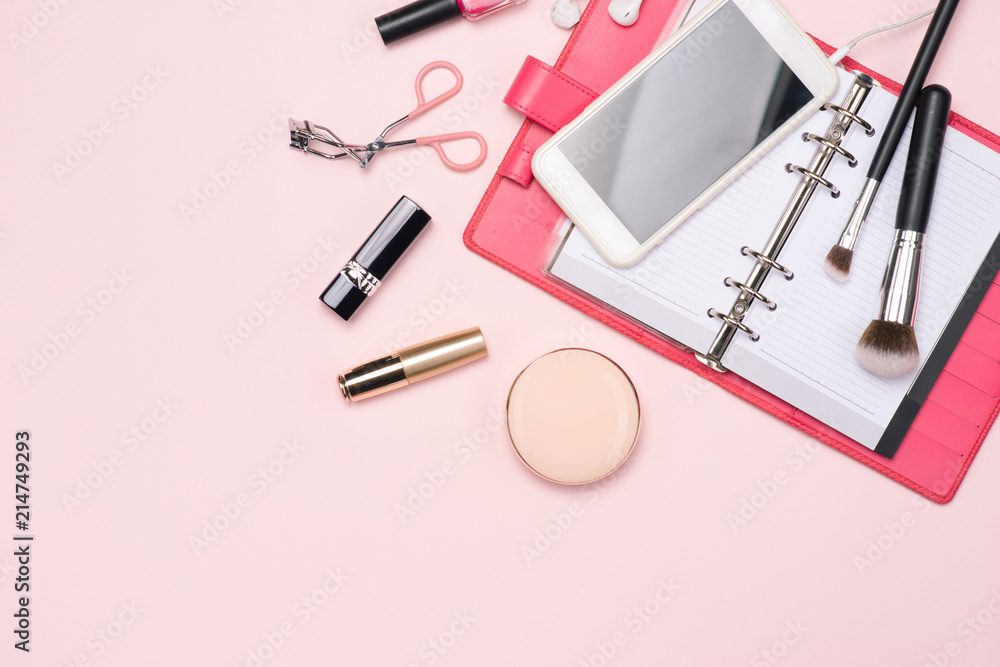 Make up or visage background. Blank page notepad and different cosmetic accessories in the holder with copy space. Make up or visage background. Blank page notepad and different cosmetic accessories in the holder with copy space.