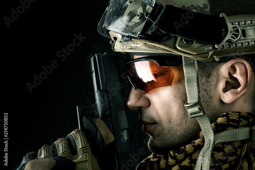 handsome military man with hand gun photo