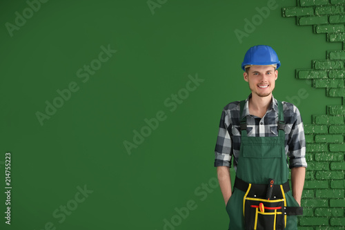 Male electrician on color b...