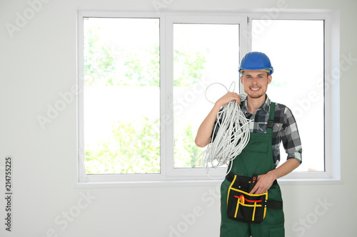 Male electrician in new flat