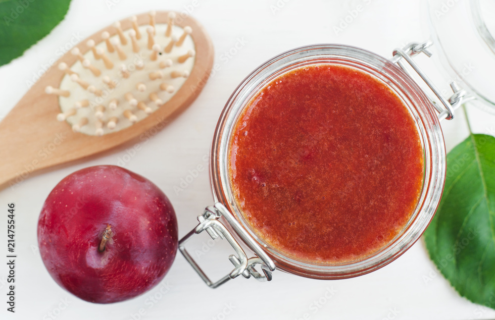 Homemade plum smoothie face and body mask/scrub in a glass jar. DIY cosmetics and spa. Copy space. Homemade plum smoothie face and body mask/scrub in a glass jar. DIY cosmetics and spa. Copy space.