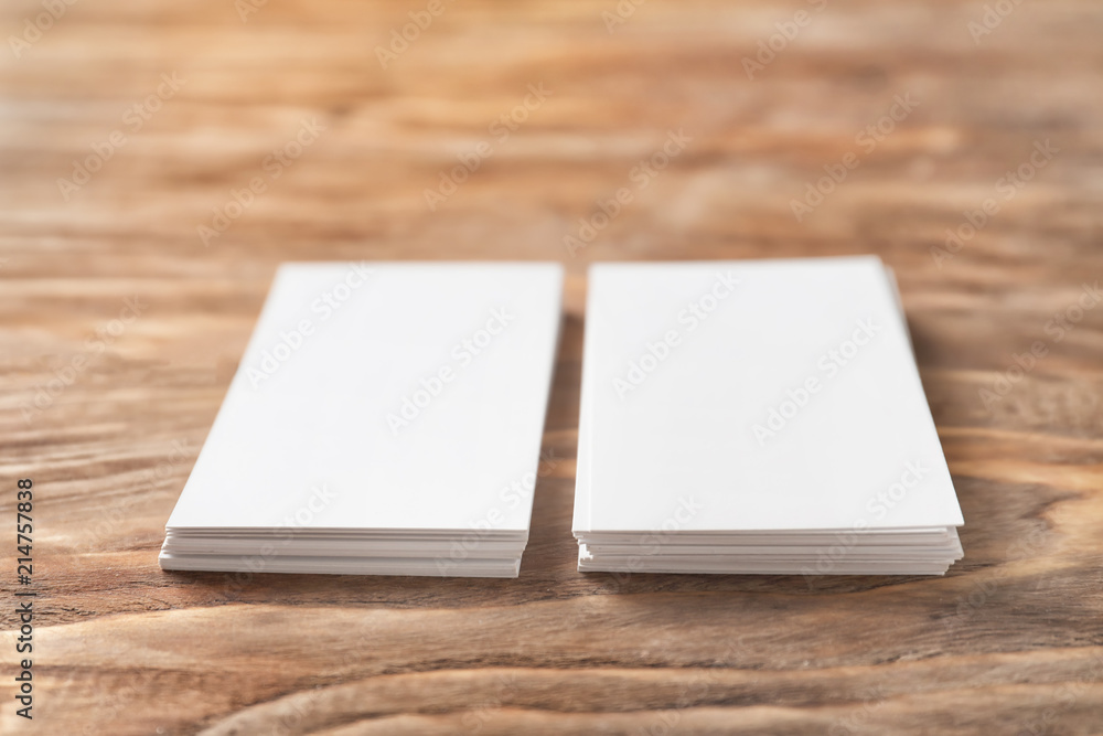 Blank business cards on wooden background Blank business cards on wooden background